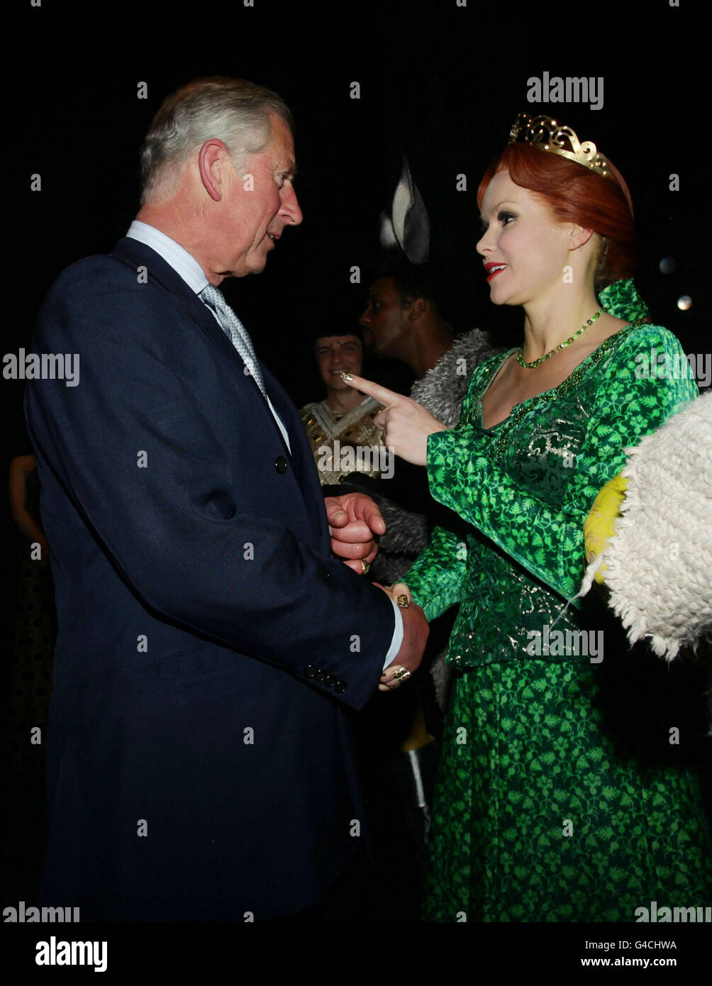 The Prince of Wales meets Amanda Holden as Princess Fiona, after a special performance of Shrek The Musical at the Theatre Royal in Drury Lane, London. Stock Photo