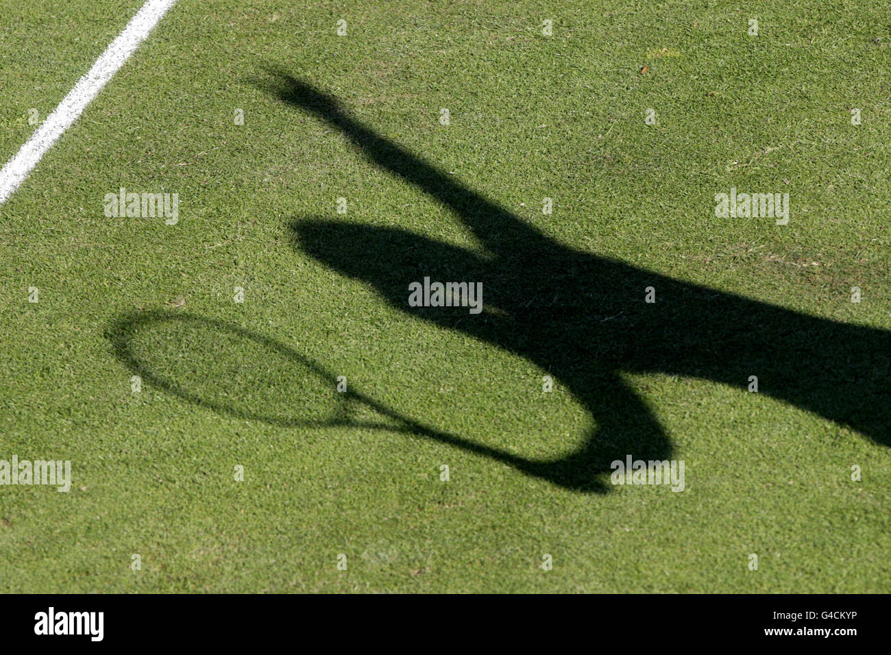 Tennis - 2011 AEGON Classic - Day Two - Edgbaston Priory Club. Detailed view of the shadow of a female tennis player preparing to serve Stock Photo