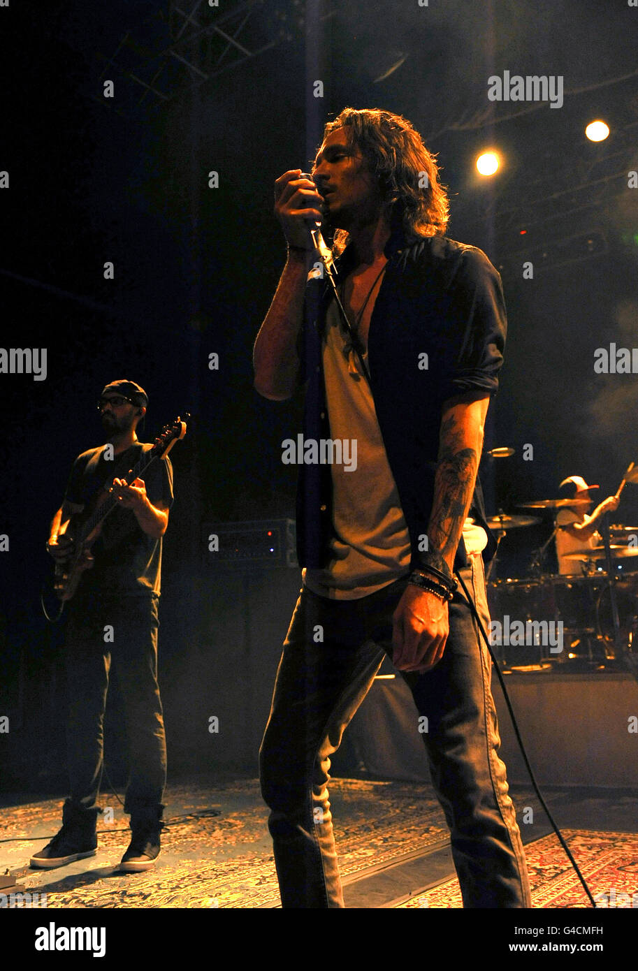 Brandon Boyd and Ben Kenney (left) of Incubus perform on stage at the HMV Forum in north London. Stock Photo