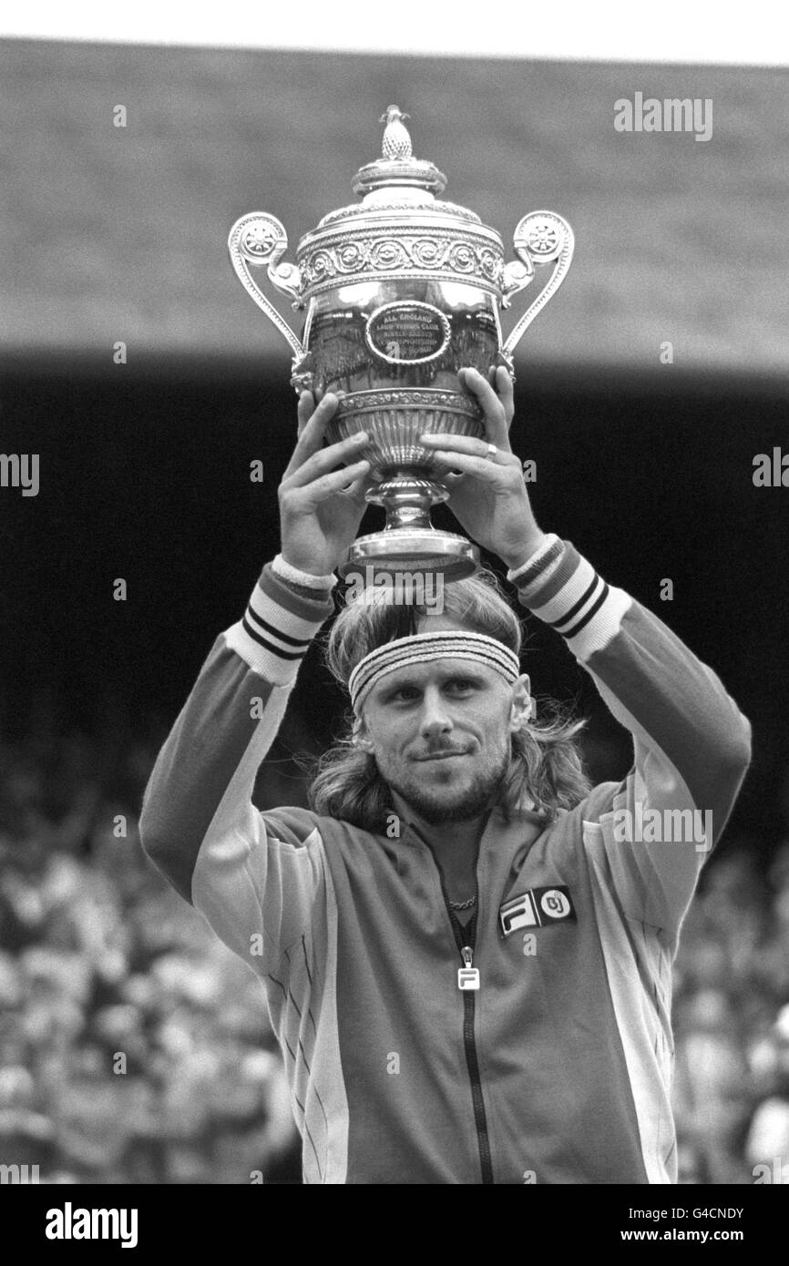 SWEDEN'S BJORN BORG RAISES THE TROPHY IN TRIUMPH AFTER WINNING THE MEN'S SINGLES TITLE FOR THE THIRD SUCCESSIVE YEAR, EQUALING THE RECORD SET BY FRED PERRY IN THE 'THIRTIES' AT THE WIMBLEDON LAWN TENNIS CHAMPIONSHIPS. HE BEAT AMERICAN JIMMY CONNORS 6-2 6-2 6-3 IN THE FINAL ON THE CENTRE COURT Stock Photo