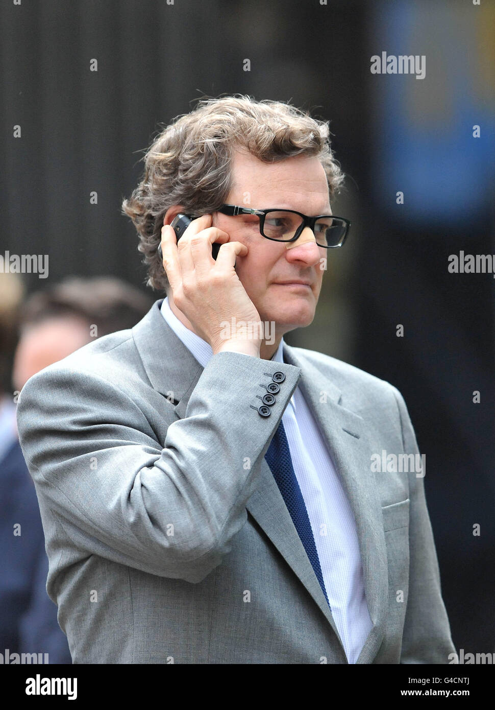 Colin Firth,wears a plaster on his nose, during filming on the set of his  new film, Gambit, which has been filming in London Stock Photo - Alamy