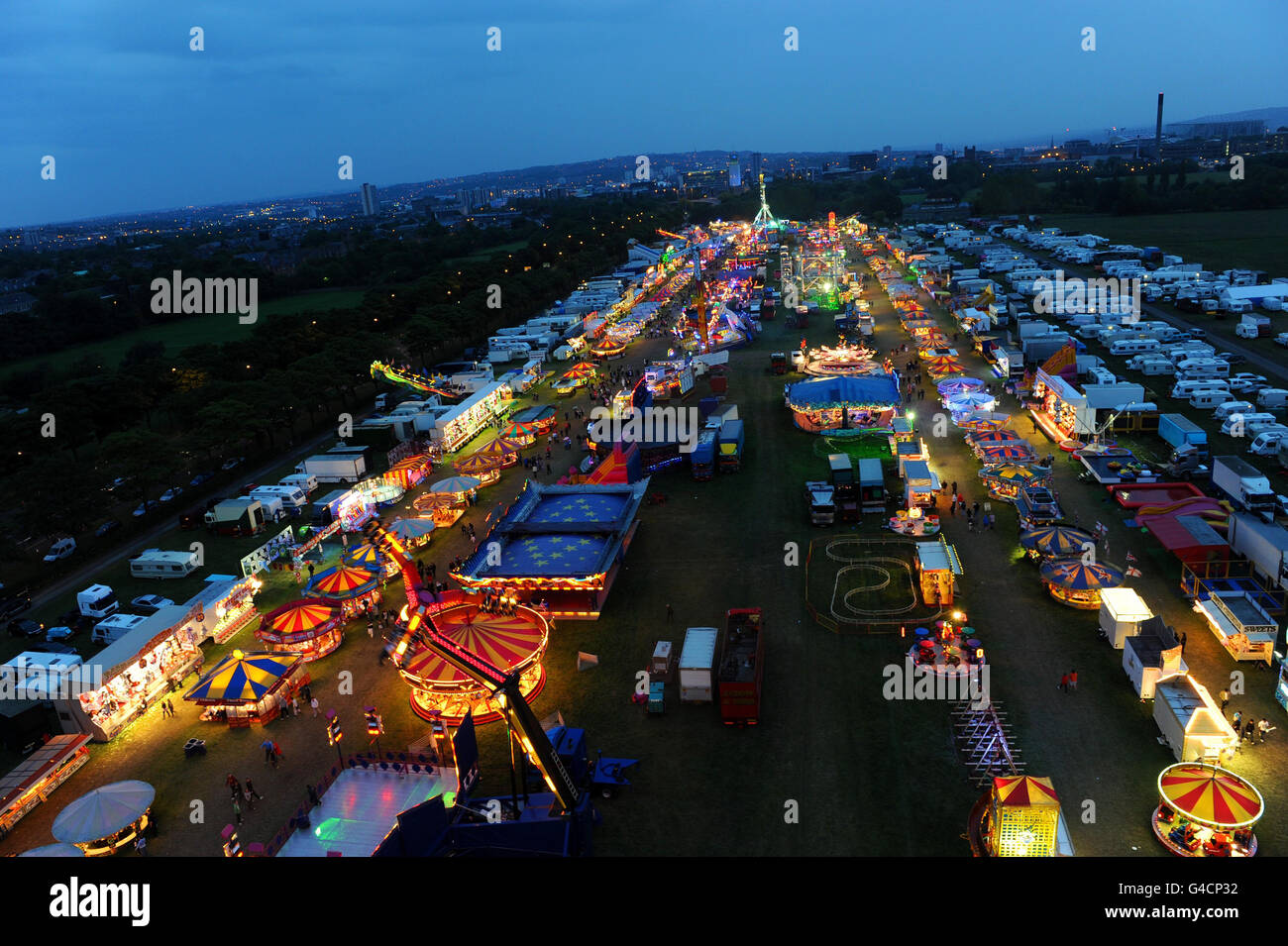 The bright lights of Hoppings Fair are seen in the evening light in Newcastle. Stock Photo