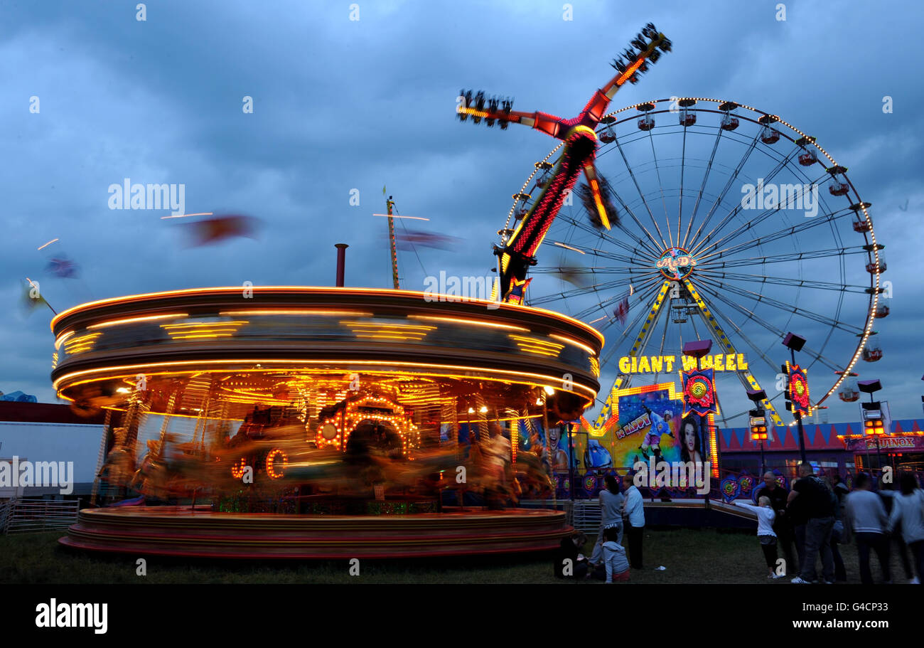 The Merry-Go-Round and the Giant Wheel at the the Hoppings Fair in Newcastle. Stock Photo