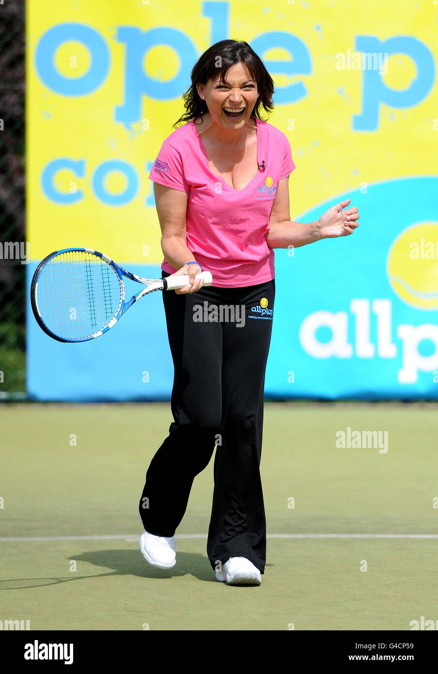Lorraine Kelly plays tennis during the Lawn Tennis Association's campagne All Play, at Wimbledon Park Tennis Courts, Wimbledon. Stock Photo