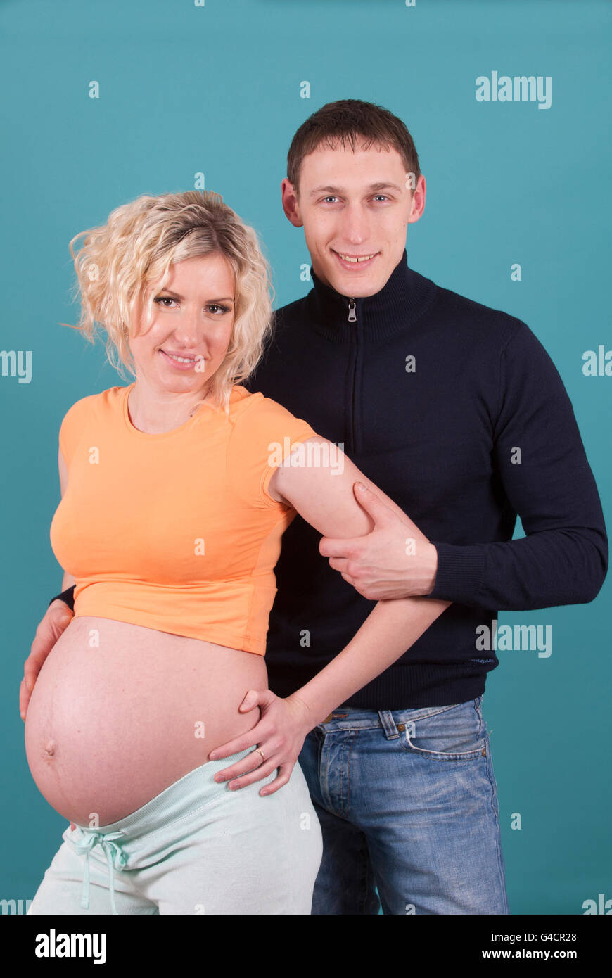Pregnant woman with man Stock Photo - Alamy