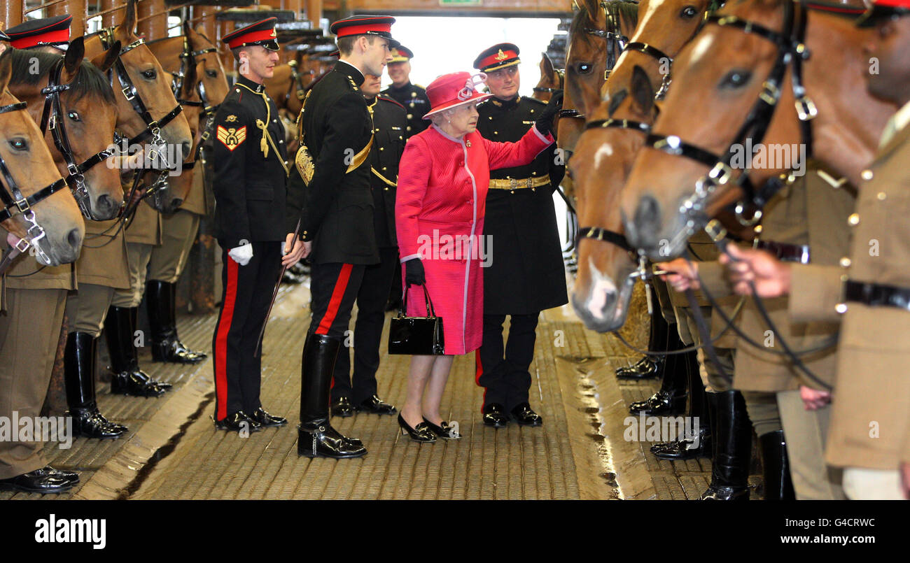 Queen Elizabeth II meets Harlequin, the horse that she gave to King's Troop, in St John's Wood Barracks on the last Royal visit to the Barracks before they move to Woolwich. Stock Photo
