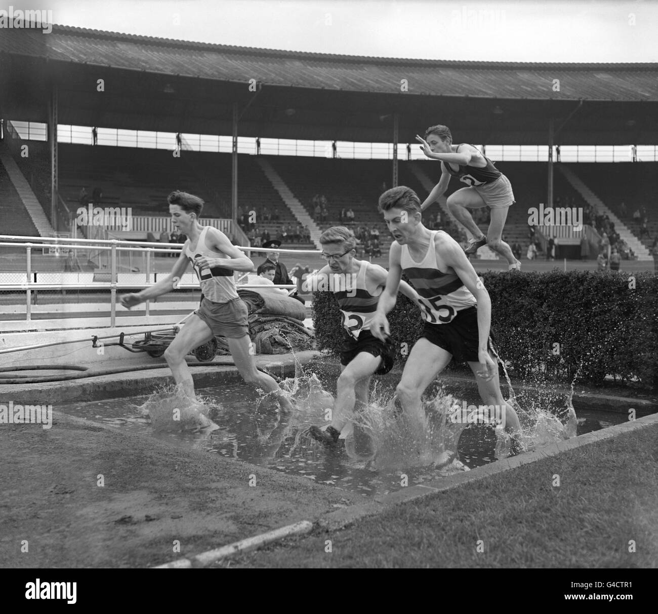The final of the 1500 metres steeplechase, left to right; R.M Simons (Haberdashes Askes), G.E Tunnell (Millfield) and A Williams (Millfield) who was the winner. Stock Photo