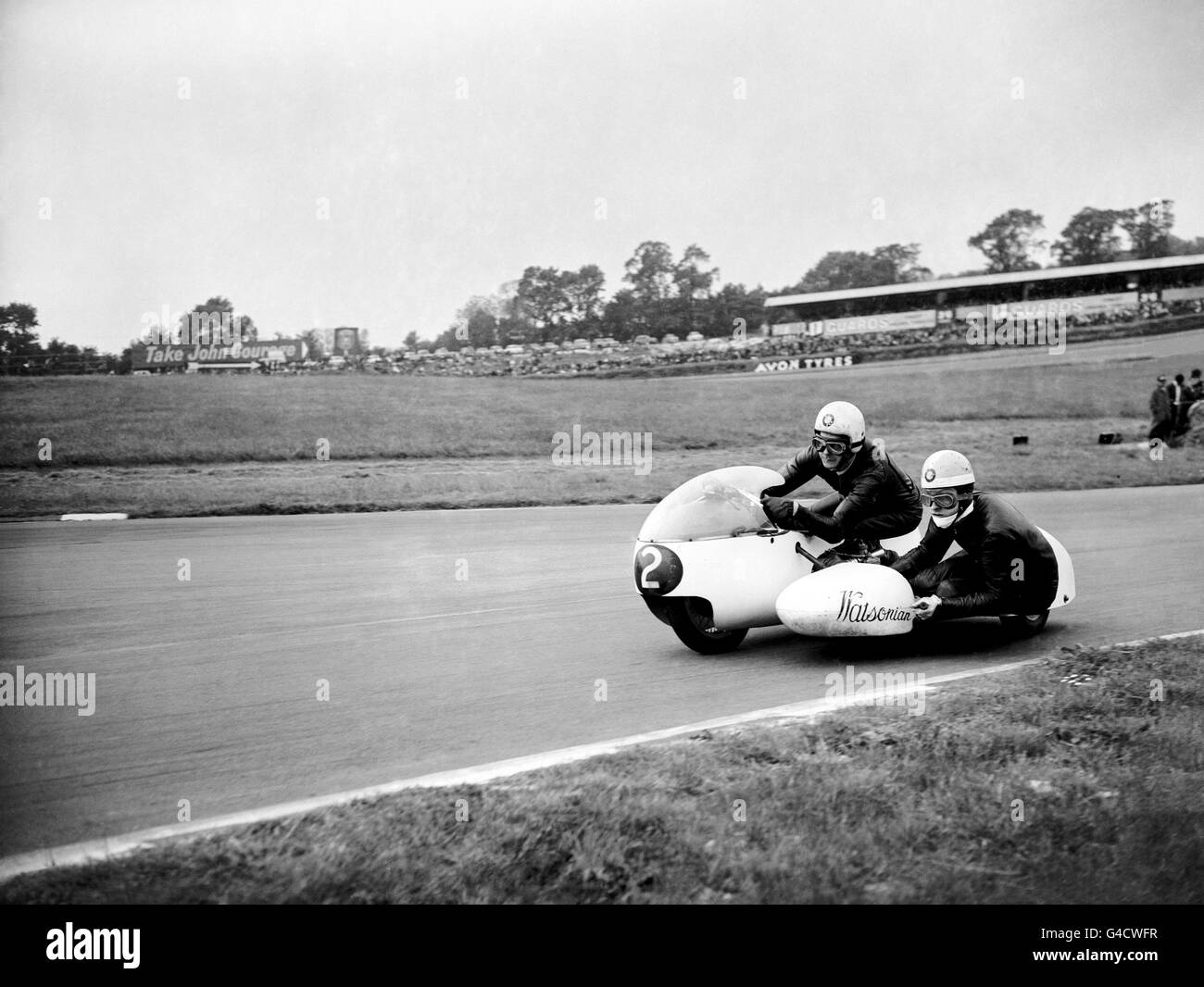 Motorcycling - Whit Monday Meeting - Three Wheeler Scratch Race - Brands Hatch. P.V Harris and his passenger R Campbell on a BMW Watsonian, winners of the Three Wheeler Scratch Race Stock Photo
