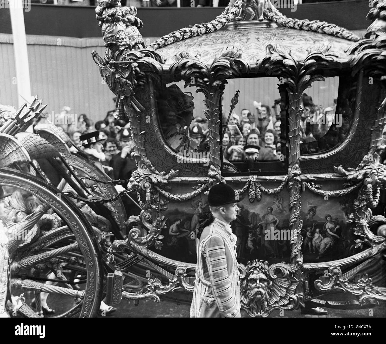 Queen Elizabeth II inside the State Coach returning to Buckingham Palace following her Coronation at Westminster Abbey. Stock Photo