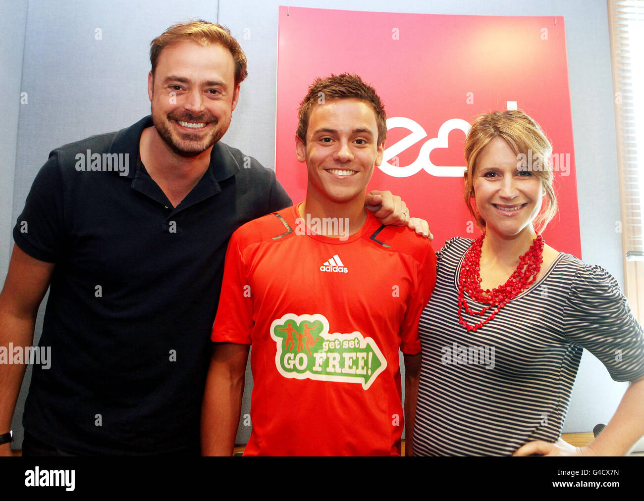 Diver Tom Daley is pictured with Jamie Theakston and Harriet Scott on Heart 106.2 where he has been talking about his career and Nestle's Get Set, Go Free campaign, which gives families the opportunity to try activities for free this summer. Stock Photo