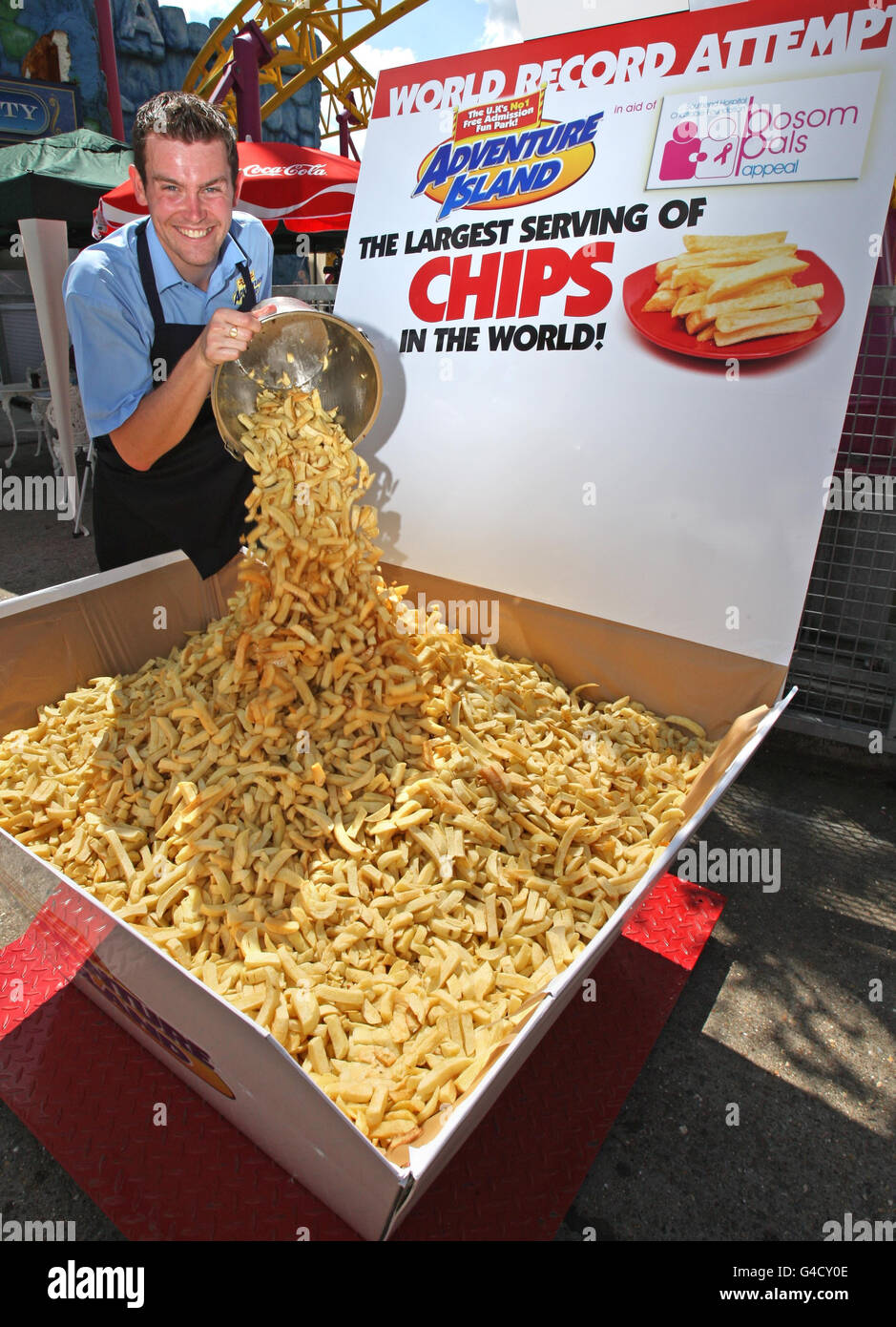 Head of Catering James Gibbs smiles after breaking the current weight of  368.5 kg of the Guinness World Record for the biggest portion of chips ever  served, at Adventure Island, Southend-on-Sea, Essex
