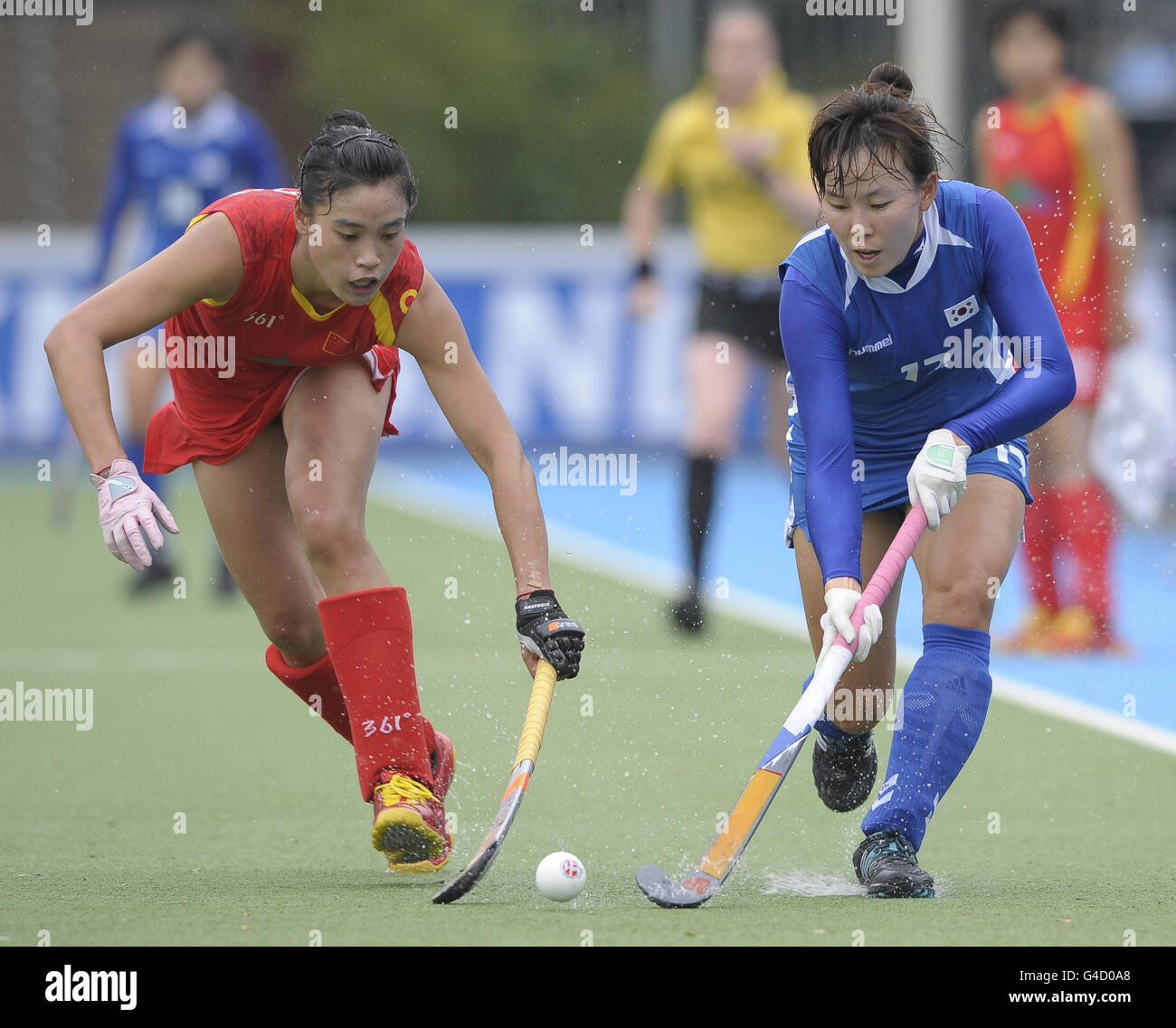 China's Wei Ma (left) challenges with South Korea's Da Rae Kim during their opening game in the Rabo FIH Women's Champions Trophy at the Wagener Stadium, Amsterdam Stock Photo