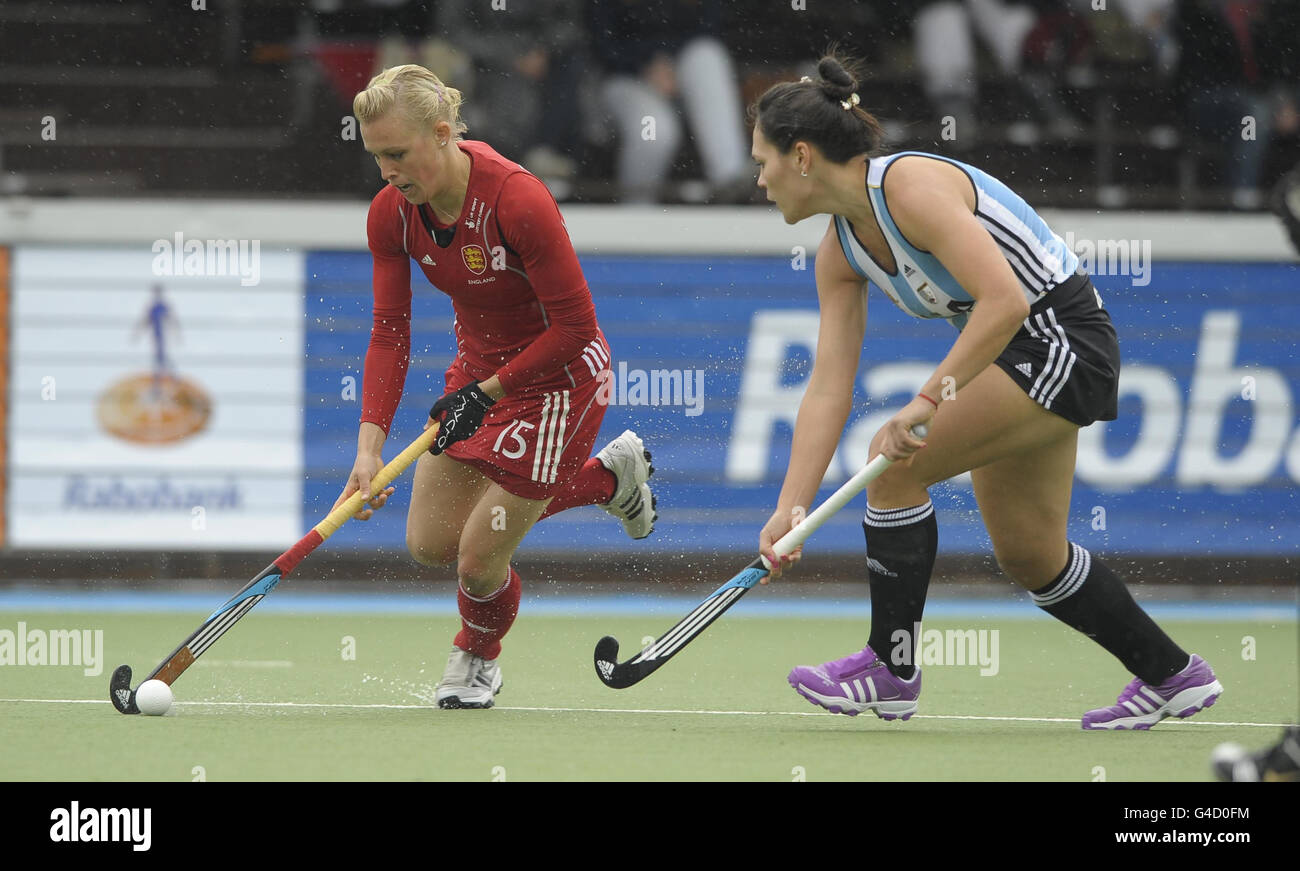 England's Alex Danson challenges with Argentina's Noel Barrionuevo during their match in the Rabo FIH Women's Champions Trophy at the Wagener Stadium, Amsterdam Stock Photo
