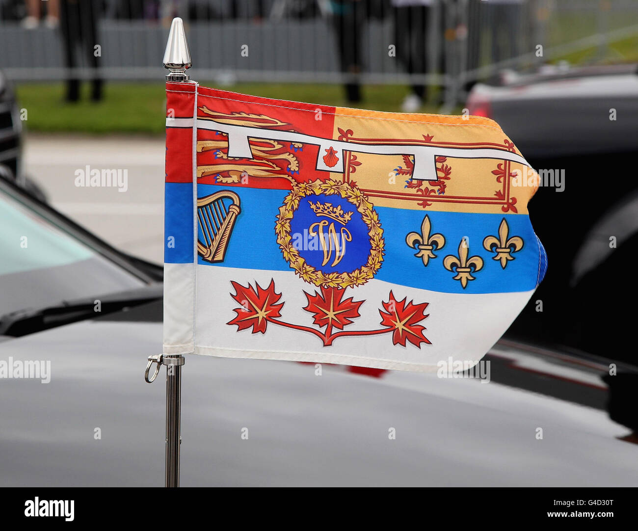 The Duke and Duchess of Cambridge flag flys on the front of his car in the convoy as he arrives at Ottawa Macdonald-Cartier International airport for the start of their visit to Canada. Stock Photo