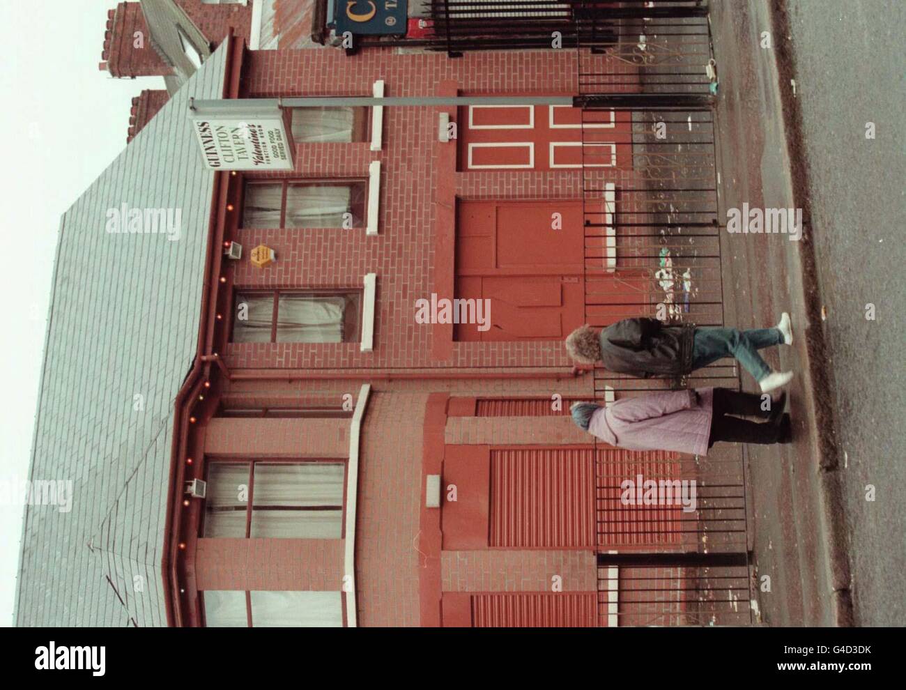 Residents of Cliftonville Road, Belfast, passing the Clifton Tavern, scene of a shooting where