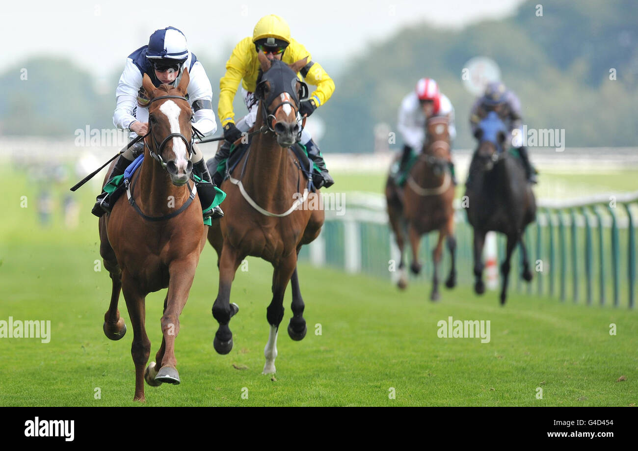 Gertrude Bell (left) ridden by William Buick wins The Bet 365 Lancashire Oaks from Polly's Mark (right) ridden by Philip Robinson during the bet365 Old Newton Cup Day at Haydock Park Racecourse, Newton-le-Willows. Stock Photo