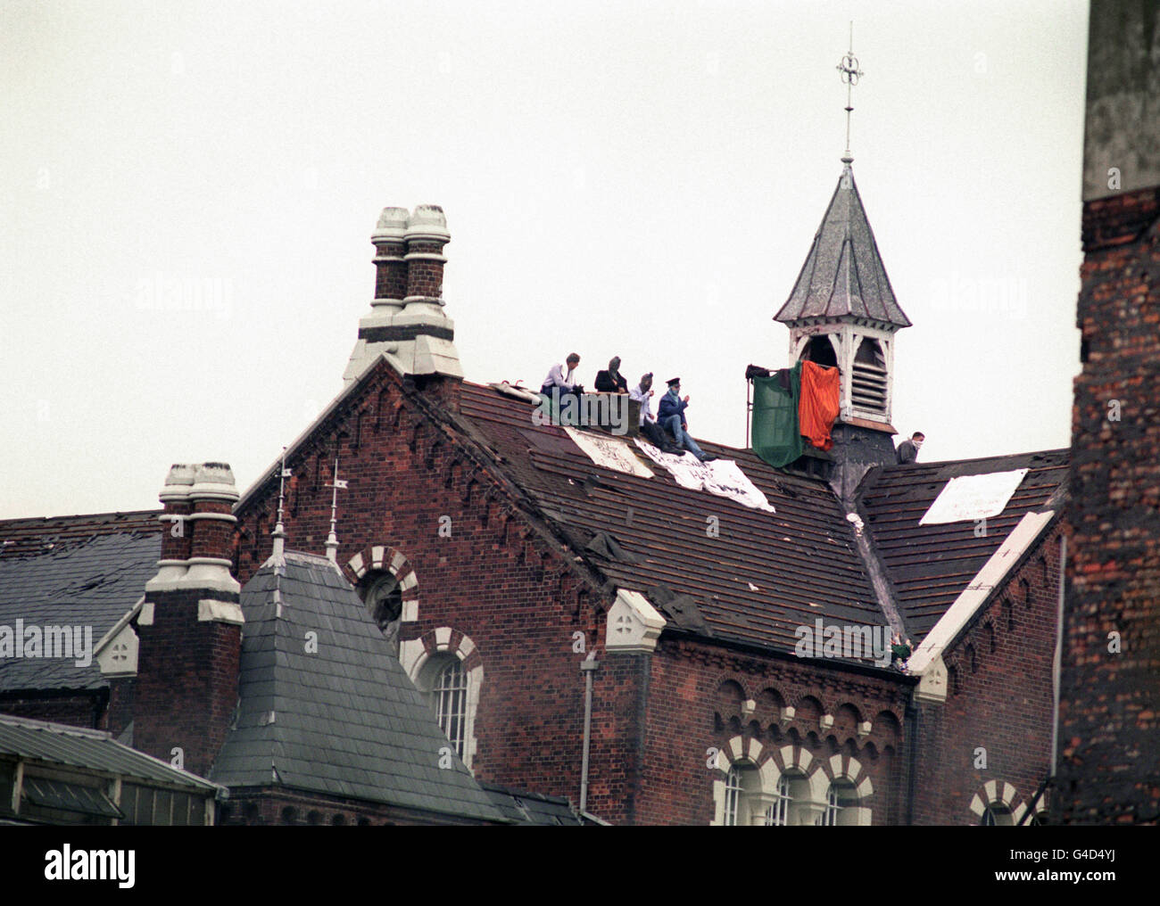 British Crime - Prison - Riots - Strangeways - Manchester - 1990. Rioting inmates on the roof of Strangeways prison in Manchester. Stock Photo