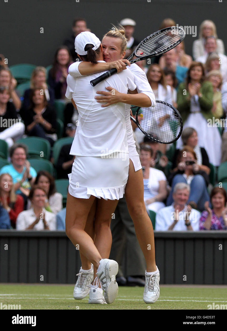 Czech Republic's Kveta Peschke (right) and Slovenia's Katarina Srebotnik celebrate after defeating Germany's Sabine Lisicki and Austria's Samantha Stosur in the ladies' doubles final on day twelve of the 2011 Wimbledon Championships at the All England Lawn Tennis and Croquet Club, Wimbledon. Stock Photo