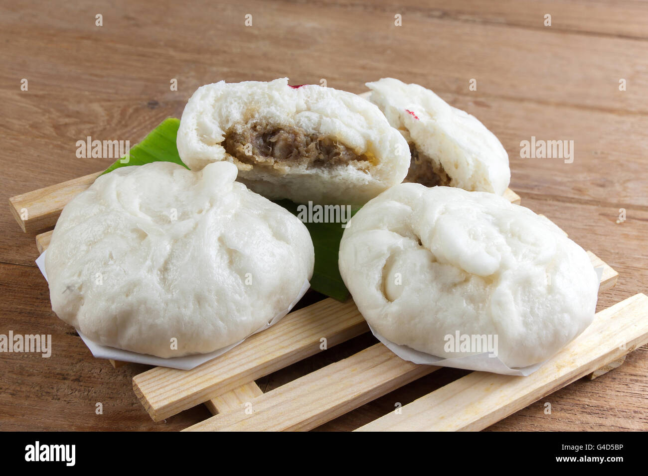 Buns of Pork stuffed on a wood plate Stock Photo Alamy