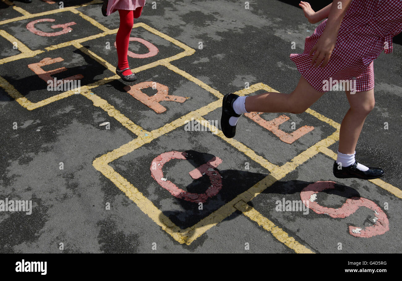 Education stock. Children at St. George's C of E Primary School in Stockport,play hop scotch during playtime. Stock Photo
