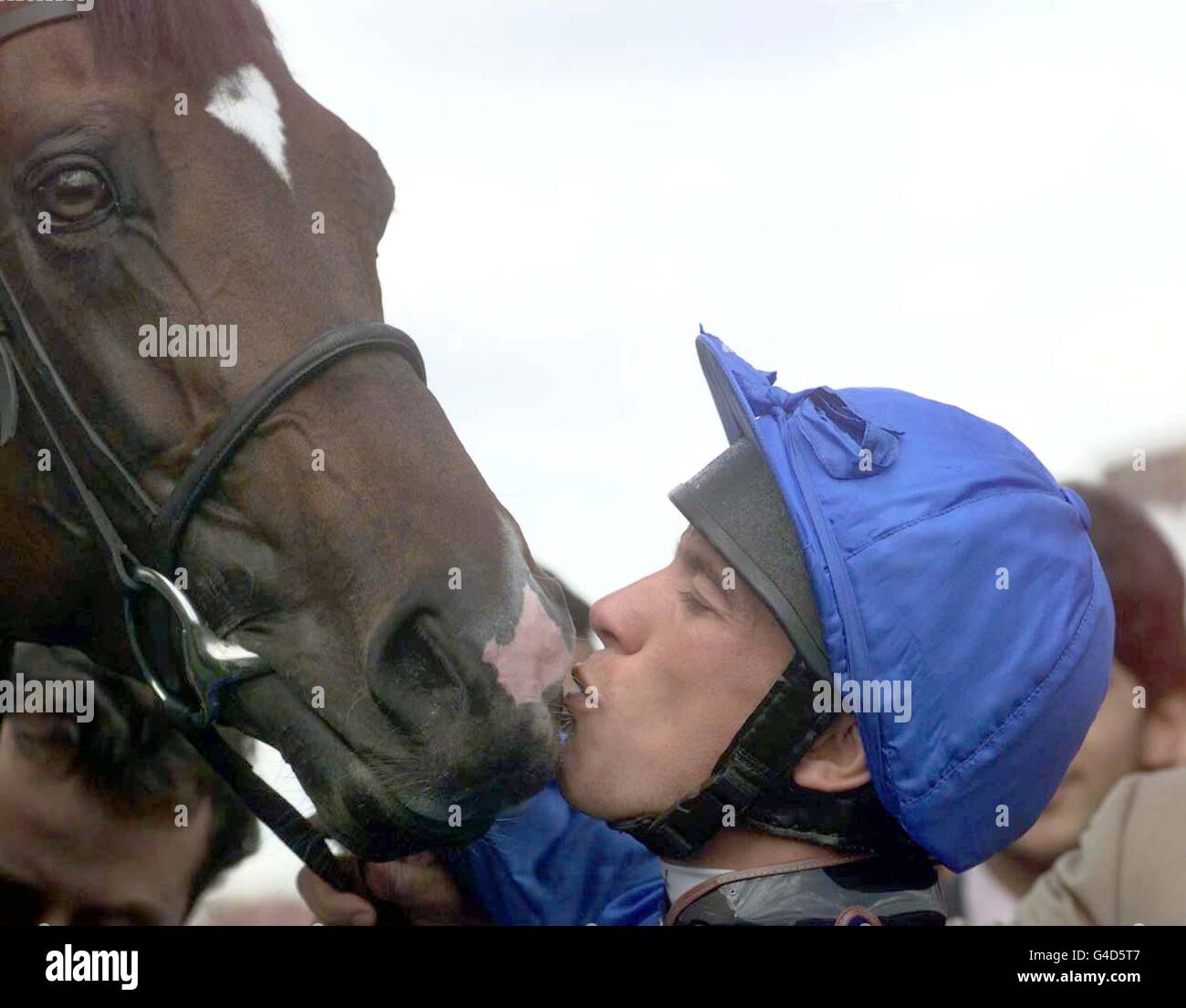 Frankie Dettori kisses Swain after after winning the King George VI and the Queen Elizabeth Diamond Stakes at Ascot this afternoon (Saturday). Photo by Adam Butler. Stock Photo