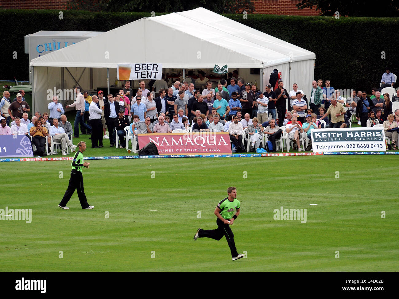 General view of fans in the crowd and the beer tent as they watch Surrey's Stuart Meaker bowl Stock Photo