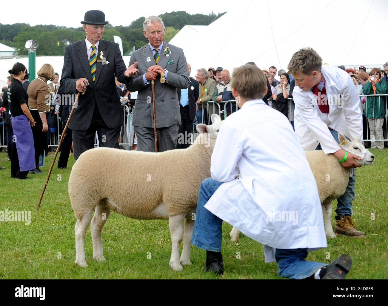 The Prince of Wales (right) talks to Chief Sheep Steward Henry Watson as they view the young sheep handlers during a visit to The Great Yorkshire Show in Harrogate. Stock Photo
