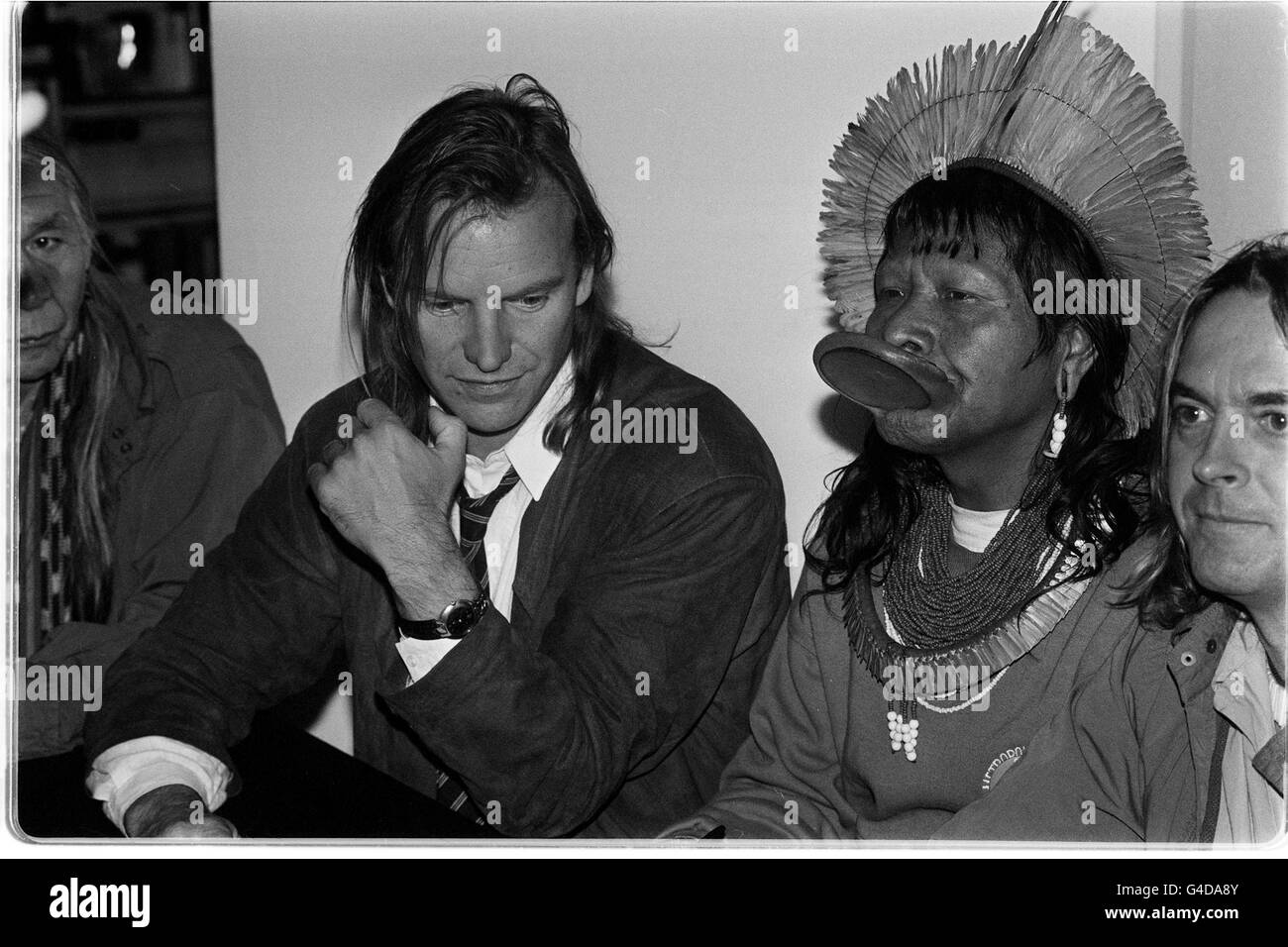 PA NEWS PHOTO 28/4/89 ROCK STAR STING WITH KAYAPO INDIAN CHIEF RAONI AT A LONDON BOOKSHOP WHERE THEY SIGNED COPIES OF 'JUNGLE STORIES - THE FIGHT FOR THE AMAZON'. THE PAIR ARE TOURING EUROPE ON A CAMPAIGN TO TRY AND HALT THE DESTRUCTION OF AMAZONIA. ROYALTIES FROM SALES OF THE BOOK WILL GO TO THE RAINFOREST FOUNDATION. Stock Photo