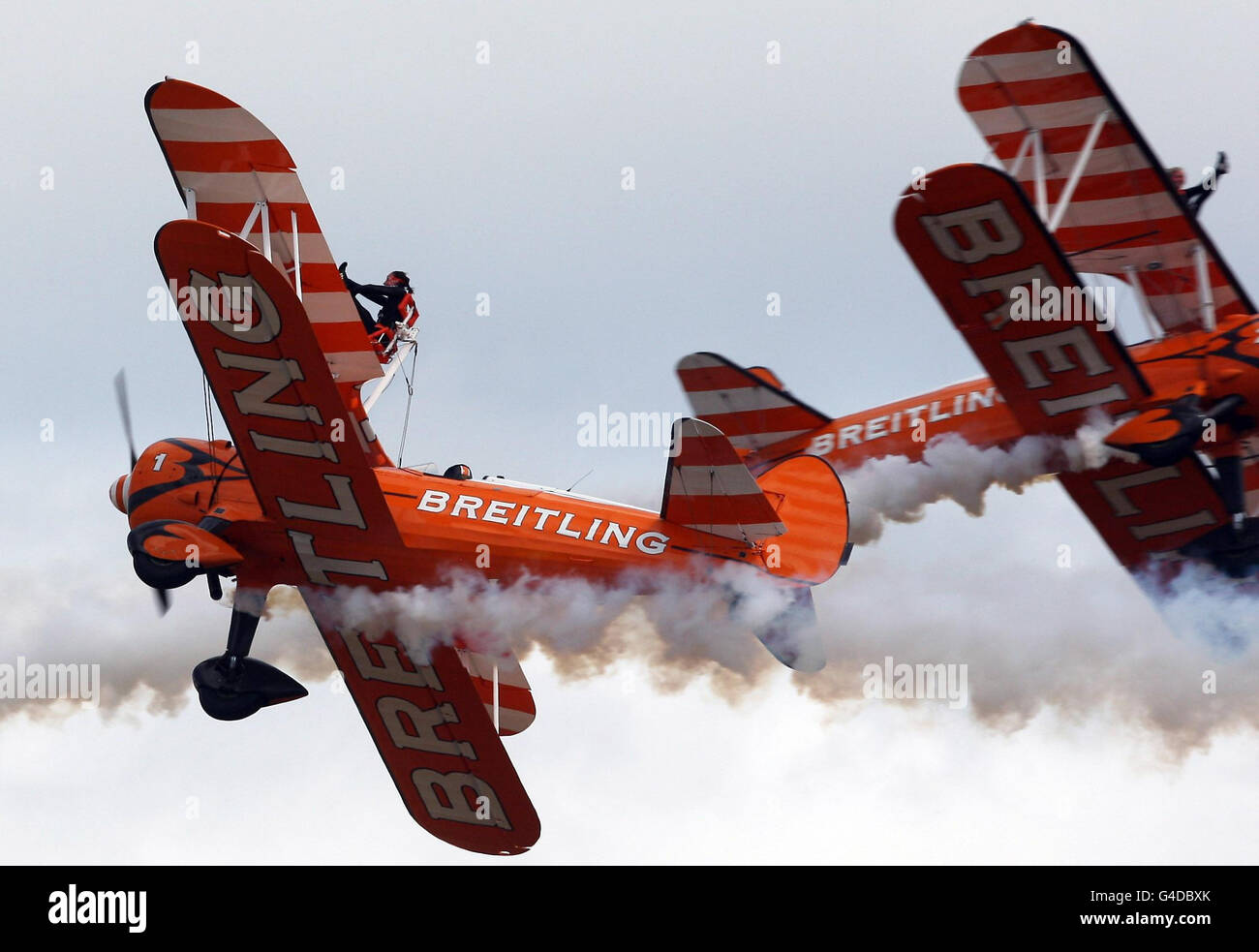 The Breitling Wingwalkers in Stearman Biplanes perform loops and rolls ...
