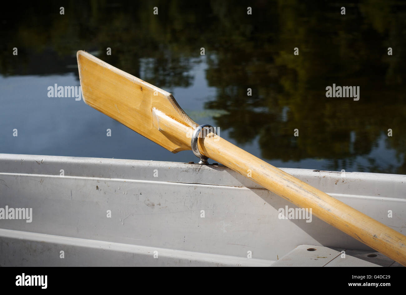 horizontal perspective view of a recreational boat on a lake with oars up Stock Photo