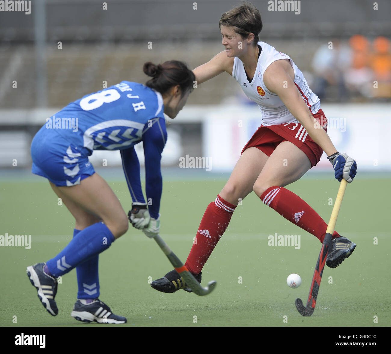 England's Sally Walton is challenged by South Korea's Jong Hee Kim (left) during the Group A match of Rabo FIH Women's Champions Trophy at the Wagener Stadium, Amsterdam, Netherlands. Stock Photo