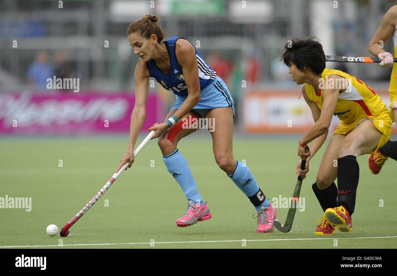 Argentina's Luciana Aymar (left) and China's Xiaoxu Xu battle for the ball during the Group A match of the Rabo FIH Women's Champions Trophy at the Wagener Stadium, Amsterdam, Netherlands. Stock Photo
