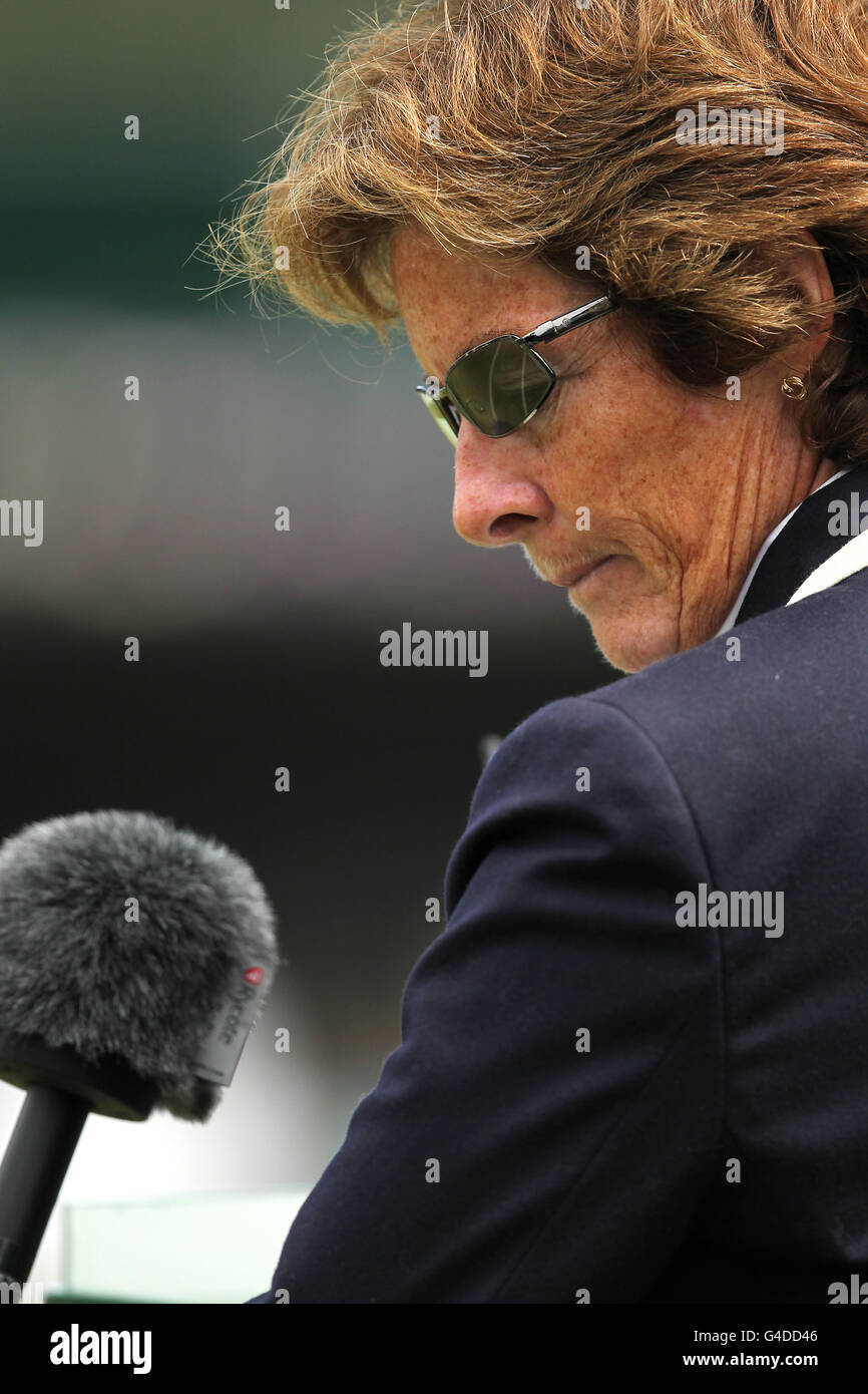 An Umpire looks down at her mic on day six of the 2011 Wimbledon Championships at the All England Lawn Tennis and Croquet Club, Wimbledon. Stock Photo