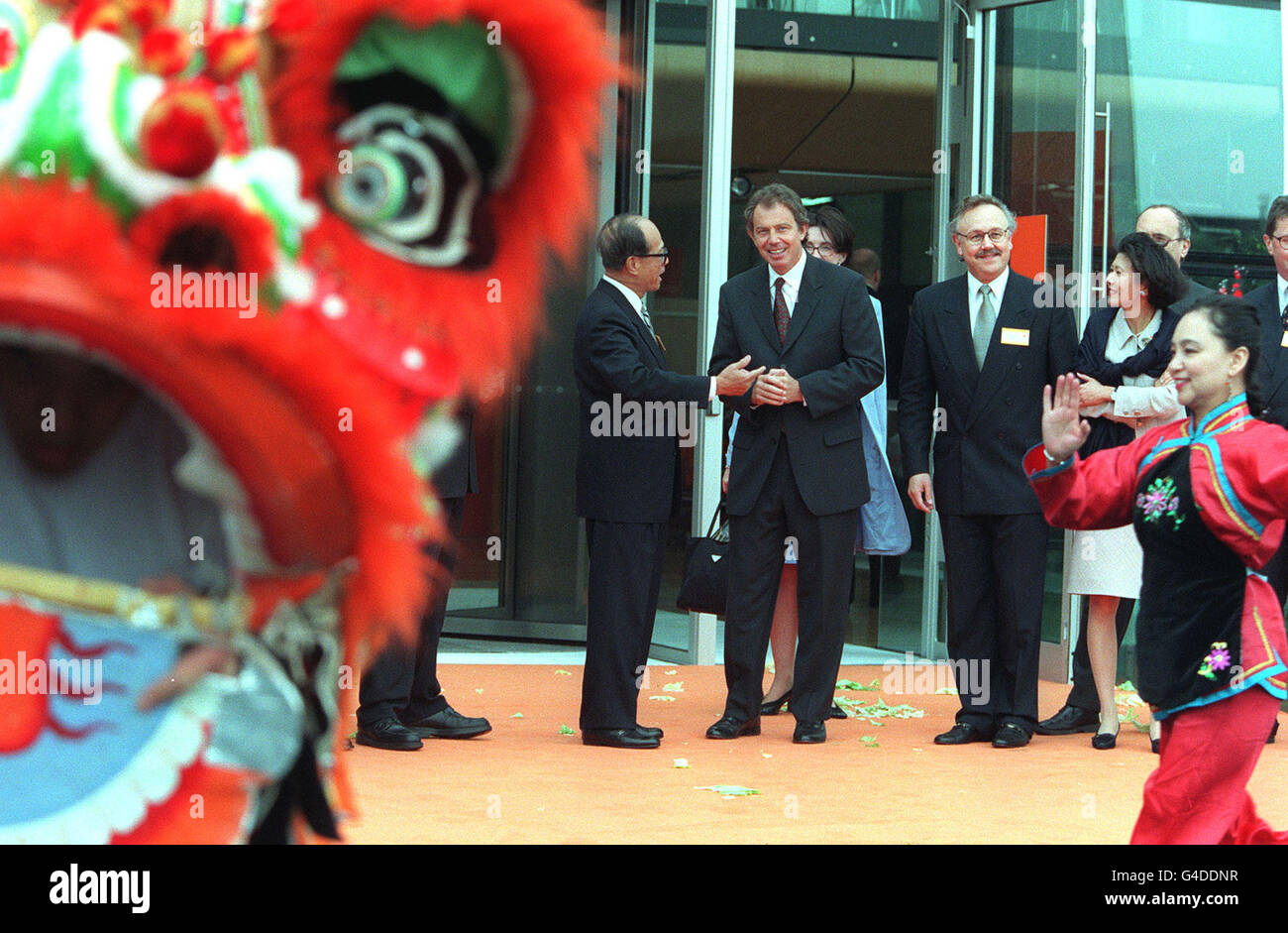 Prime Minister Tony Blair (second left) talks to wealthy Hong Kong businessman Mr Li Ka Shing (Chairman of Cheung Kong) during the official opening of the 11m Orange Call Centre in Darlington - the town's largest employer this afternoon (Friday). See PA story POLITICS Blair. Photo by Owen Humphreys/PA Stock Photo