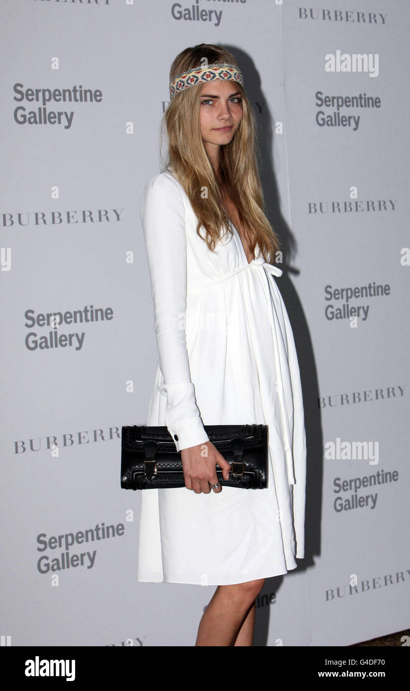 Cara delevingne arrives serpentine gallery in hyde park hi-res stock