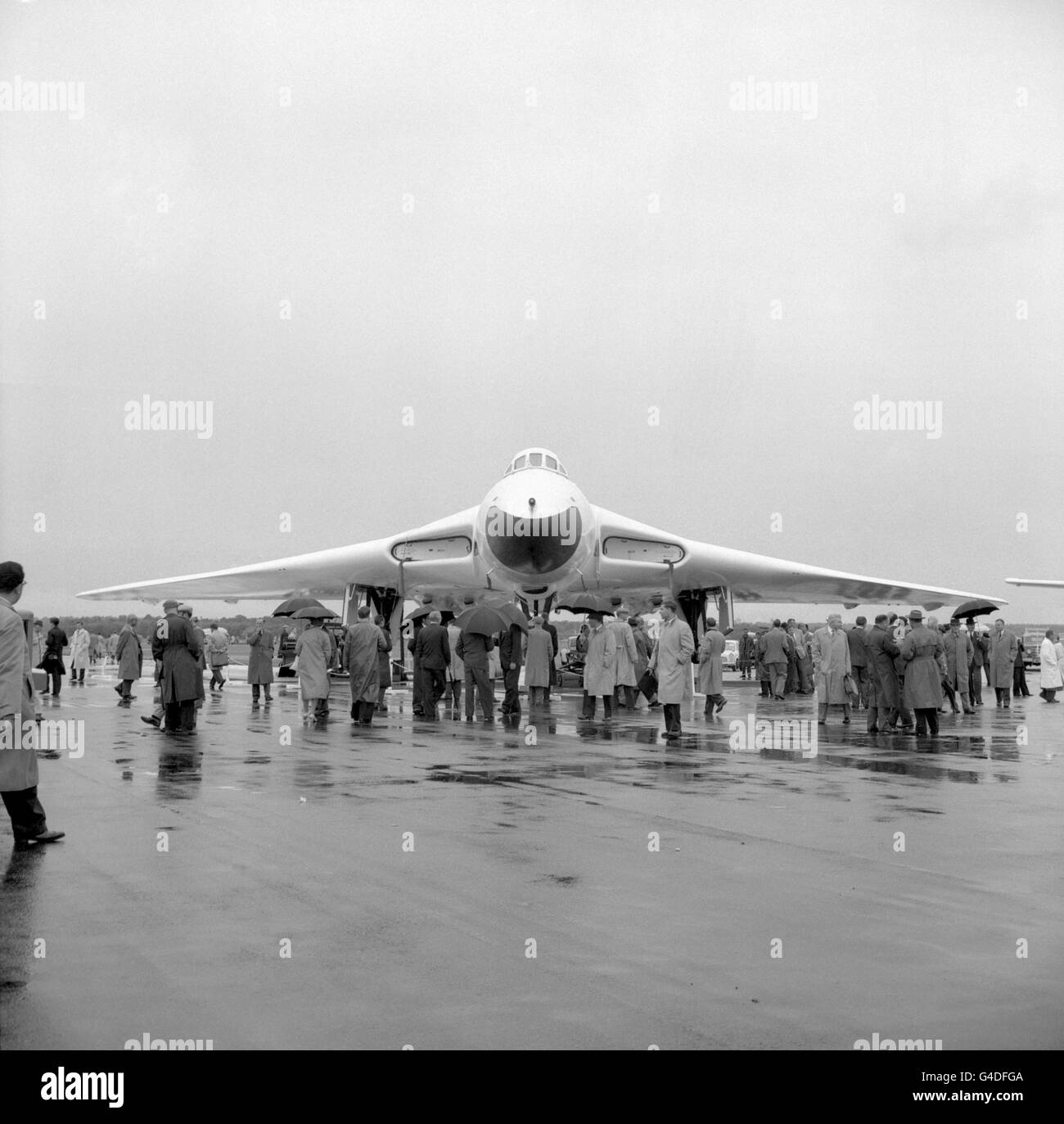 An RAF Vulcan bomber is inspected by interested viewers at the Farnborough Airfield Stock Photo