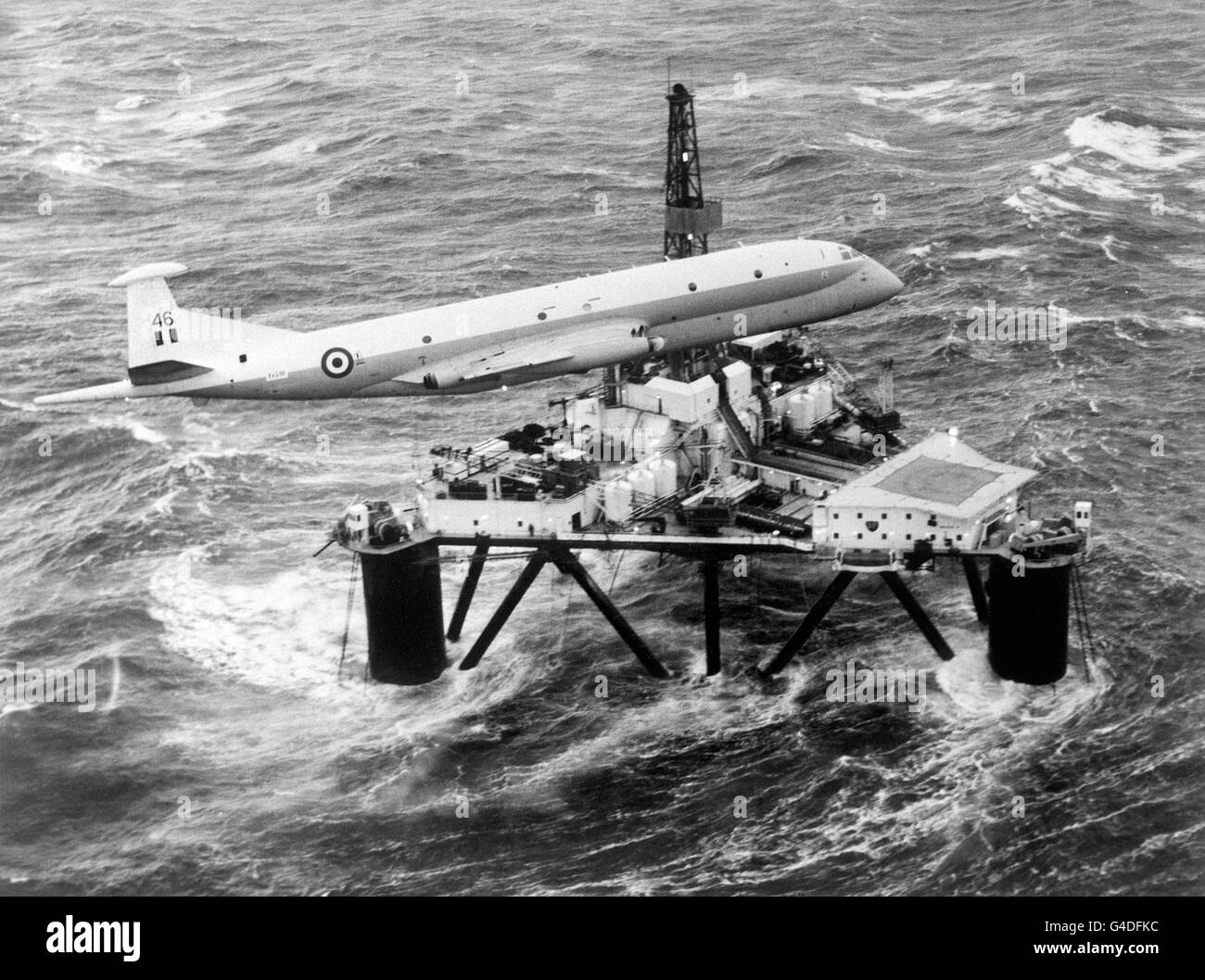 An RAF Hawker Siddeley Nimrod checks all is well on a North Sea oil rig during a routine offshore patrol with a Vulcan bomber (not pictured) Stock Photo