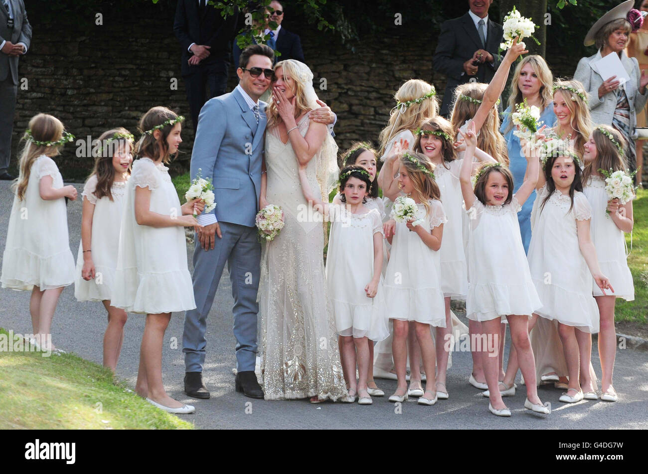 Kate Moss with her new husband Jamie Hince pose with bridesmaids after their wedding at St Peter's Church in Southrop. Stock Photo