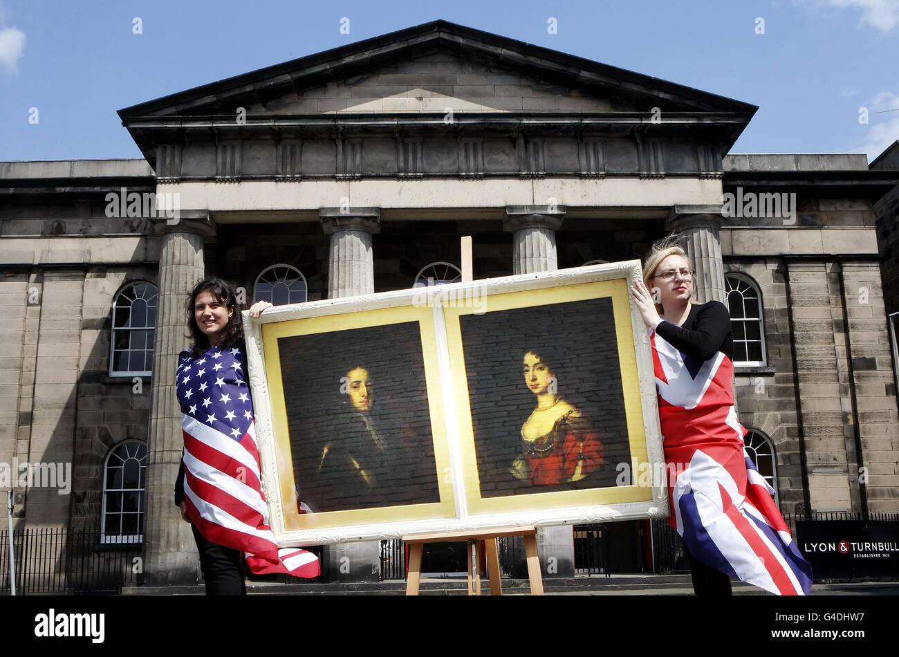 Freemans auctioneers employee Clemence Duchon (left) and Lyon & Turnbull auctioneers employee Rebecca Wall, hold an old master painting of King William of Orange and Queen Mary painted by an unknown artist from the school of Sir Godfrey Kneller, to promote a joint Old Master Paintings Sales. Stock Photo