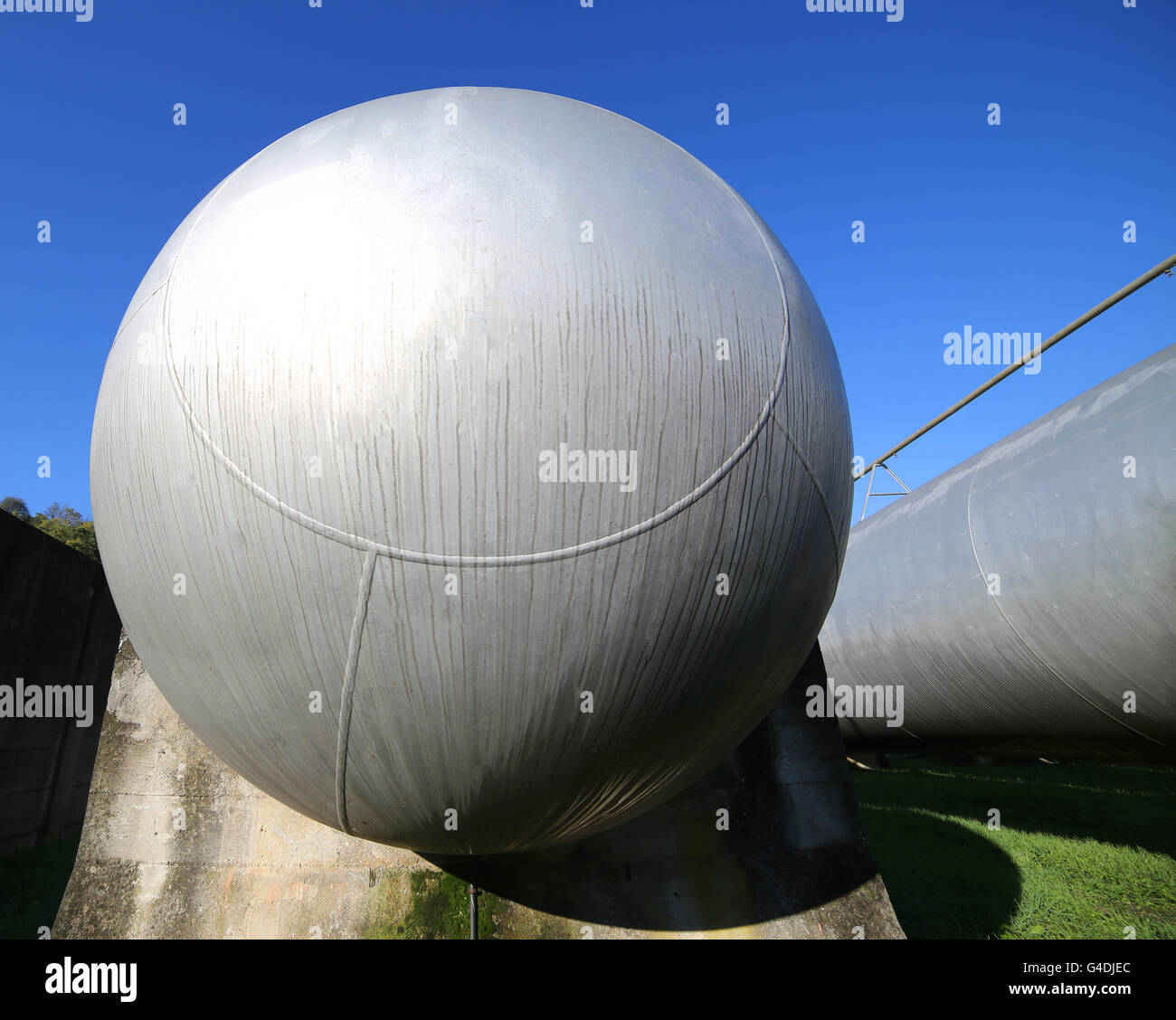 giant gas tank for the storage of flammable propane gas in the fuel production refinery Stock Photo