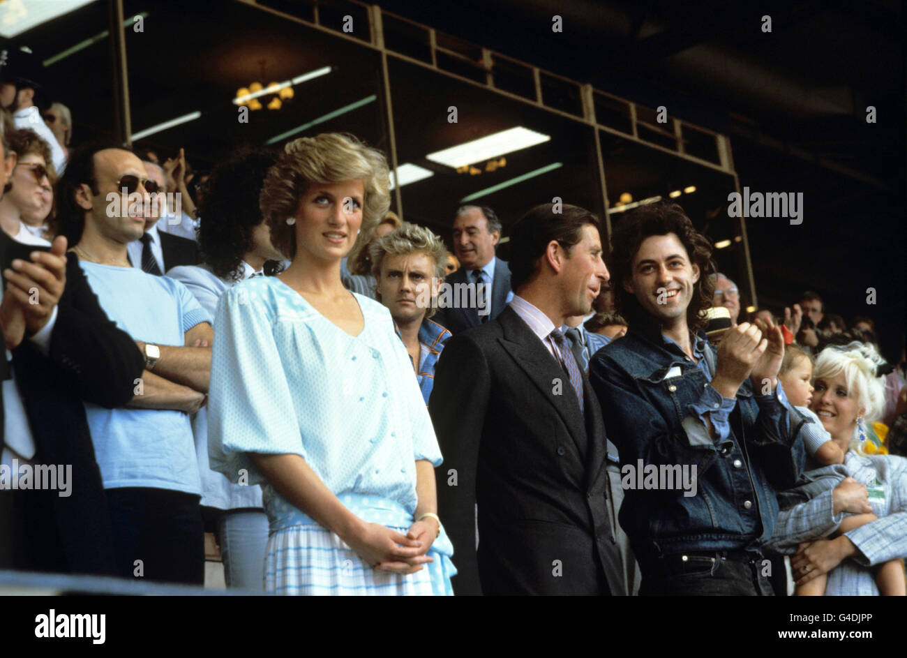 L-R: The Princess of Wales, the Prince of Wales and Sir Bob Geldof, organiser of the Live Aid music concert, which raised millions of pounds for famine relief and his former wife, the late Paula Yates (far right), at Wembley Stadium, London. Stock Photo