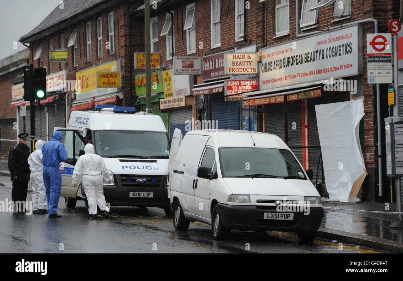 Police attend the scene of a fatal stabbing in Burnt Oak, north London. Stock Photo