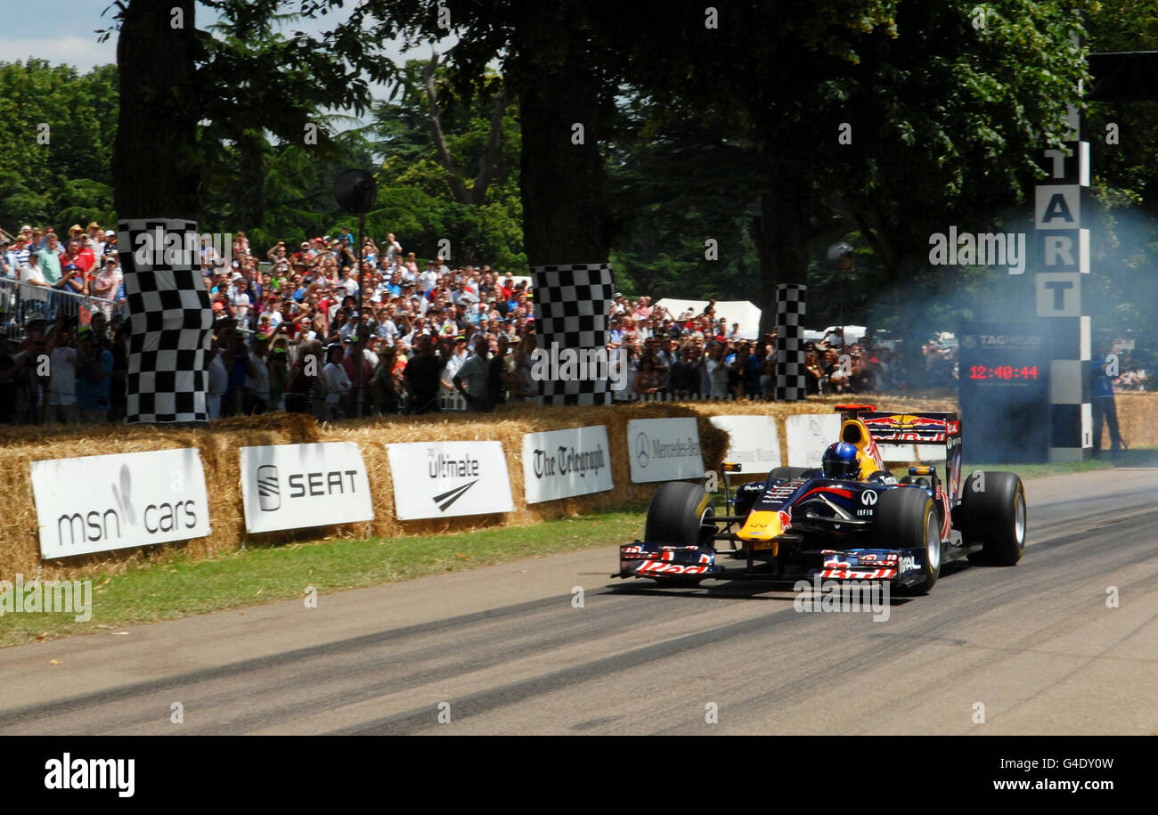 Red Bull designer Adrian Newey drives a Red Bull F1 car during the hill climb event at the Goodwood Festival of Speed in Chichester, West Sussex. Stock Photo