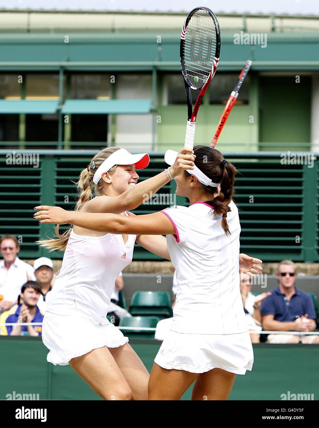 Canada's Eugenie Bouchard (left) and USA's Grace Min celebrate winning the  Girls' Doubles on day thirteen of the 2011 Wimbledon Championships at the  All England Lawn Tennis Club, Wimbledon Stock Photo - Alamy