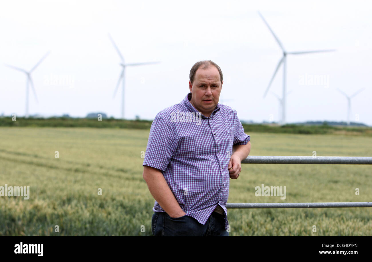Julian Davis at the entrance to Grays Farm, his property in Deeping St Nicholas, near Spalding, Lincolnshire as Julian and Jane Davis are seeking an injunction and damages in the High Court against the owners and operators of the wind farm in Lincolnshire they say drove them from their farmhouse home with its 'unbearable' noise. Stock Photo