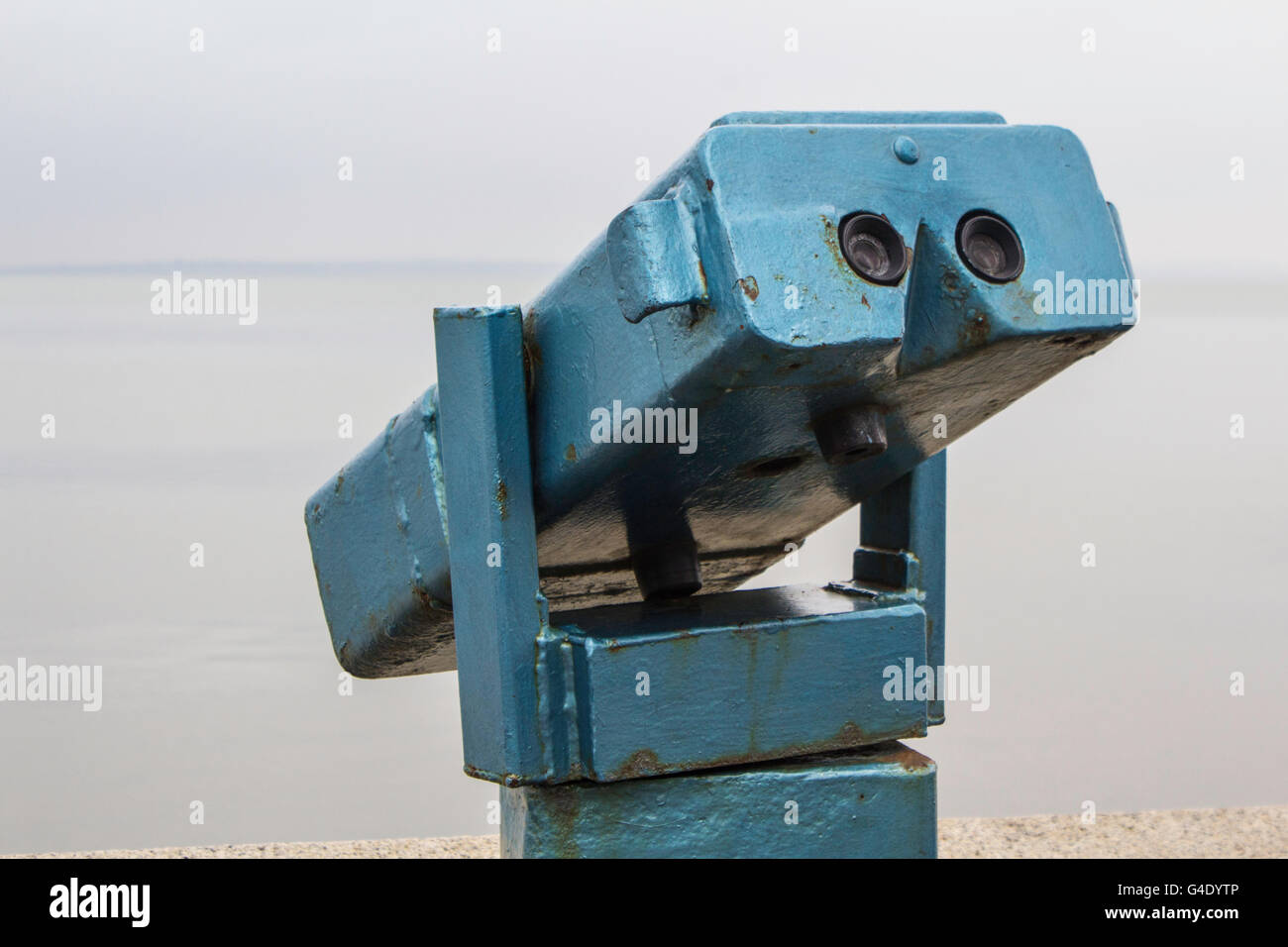 Blue seaside coin operated telescope Stock Photo - Alamy