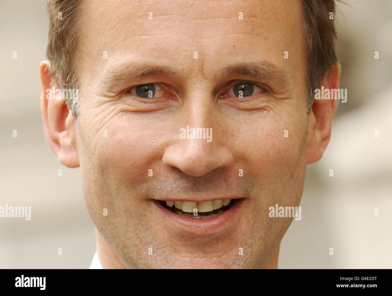 Culture Secretary Jeremy Hunt, as he walks to the House of Commons, in Westminster, central London, after he announced he is seeking fresh advice from Ofcom and from the Office for Fair Trading (OFT) on whether he should refer Rupert Murdoch's bid for broadcaster BSkyB to the Competition Commission. Stock Photo