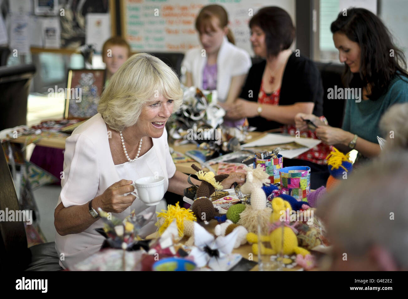 The Duchess of Cornwall enjoys a cup of tea during her visit to the Culm Valley Integrated Centre for Health, Cullompton, Devon . Stock Photo