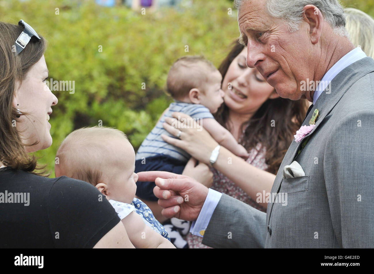 Britain's Prince Charles talks to Sarah Lush and her baby Anya, aged four months, from Cullompton in Devon during his visit to the Culm Valley Integrated Centre for Health in Cullompton. Stock Photo