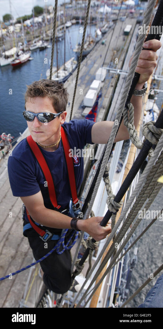 Deckhand Daniel Bencz checks the rigging onboard the Wylde Swan, one of